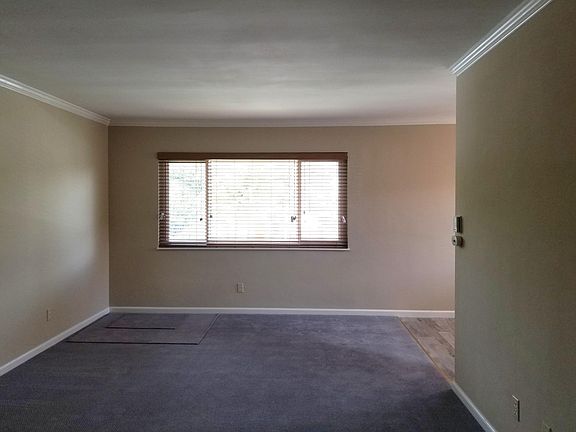 Living room with dining room to the right.