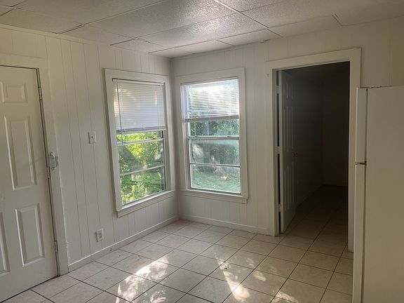 Kitchen with door into laundry room (where garage door is located)