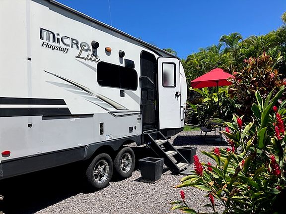 Cozy RV with slide out that provides a breakfast nook. Umbrella table for outside eating!