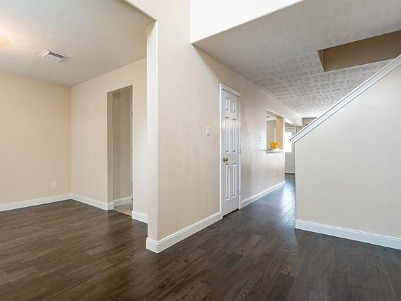Gorgeous engineered hardwood flooring flows from the entry, formal dining room and family room!