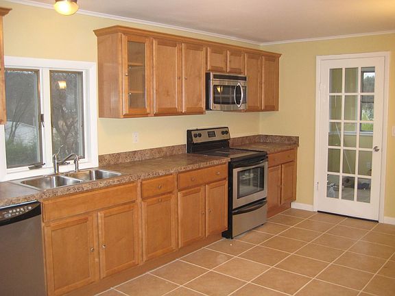 totally updated kitchen with door leading to sun porch