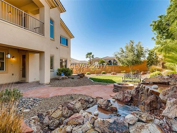 Large backyard with lush landscaping.