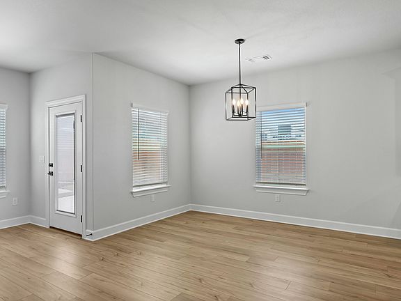 The dining room sits right off of the kitchen.