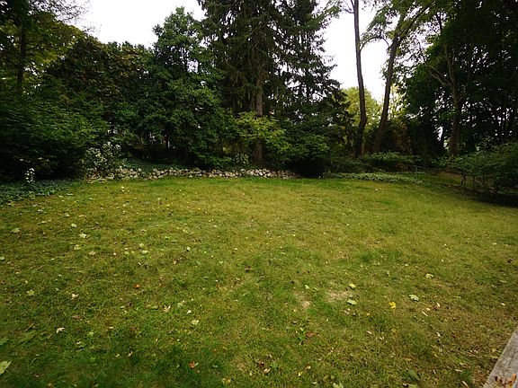 Wide and spacious back yard. Very private with luscious green bushes.