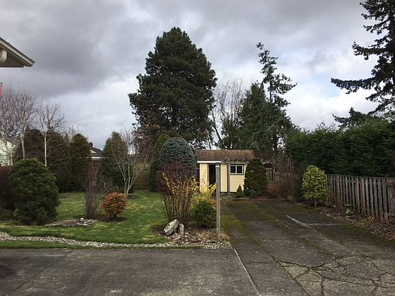 fenced back yard w/ shed