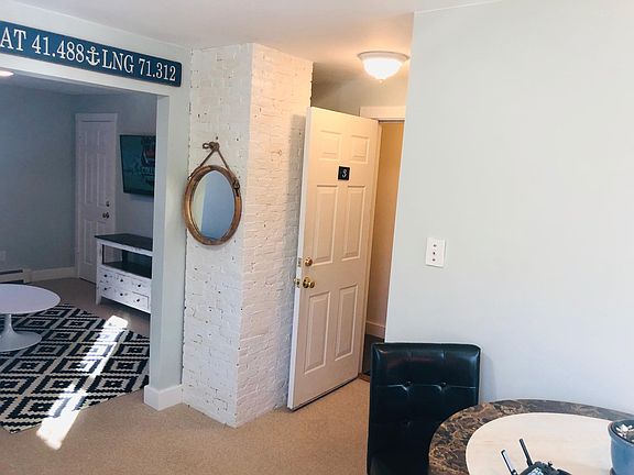 View into the living room and entrance on right