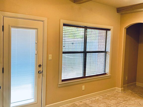 Dining area and backdoor leading into private yard