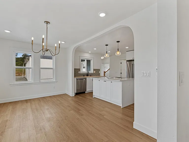 Elegant dining space lined with custom windows for quiet enjoyment.