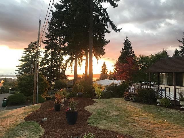 View of Lake Washington, Olympic mountain range, city and sunsets.