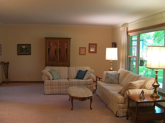 Living Room 11x8, new carpet, large bay window looking out to wooded yard
