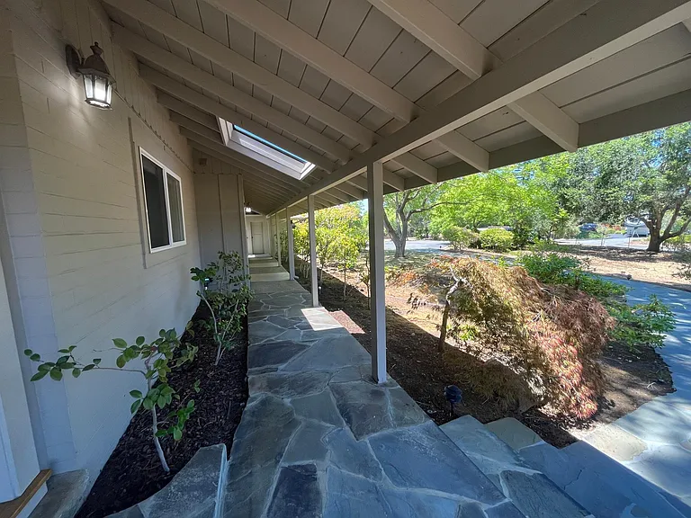 The tranquil stroll through the garden path and the covered walkway