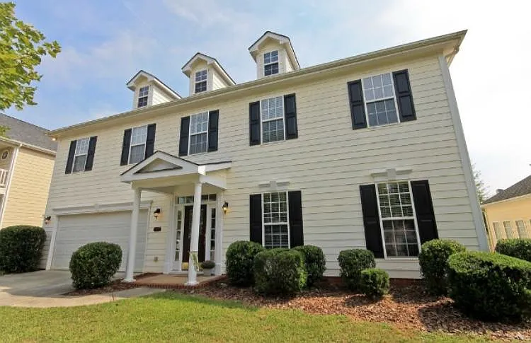 Picture of the exterior of the home. The room for rent is the far right upstairs cor window.