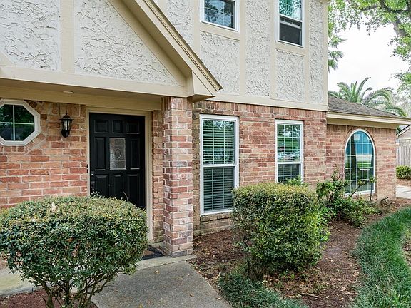 A covered front porch area waits for you to greet your friends!