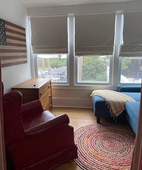 1st floor den/guest bedroom/home office (couch pulls out) Currently there is a desk where the dresser is to serve as home office. Overlooks pool