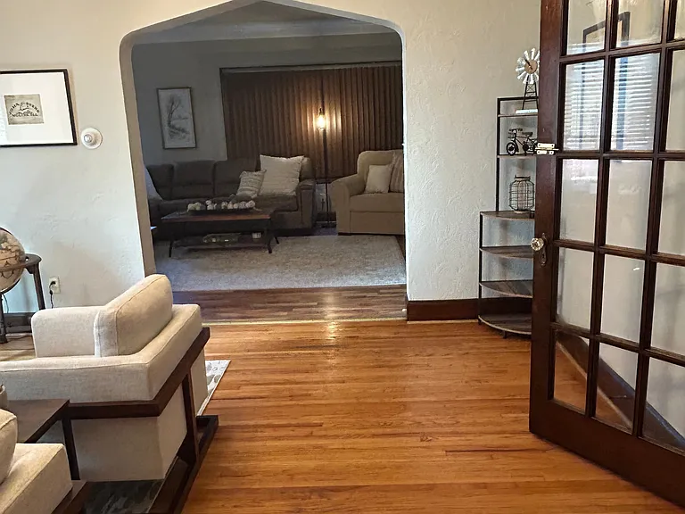 Just steps from the kitchen is your office and bedroom. You can also see through the arched walkway directly into the living room.