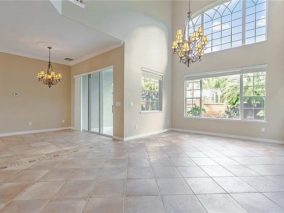 Sliding glass doors across the back of the home....great room and kitchen eating area shown.
