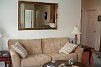 Living room opens to balcony and kitchen/dining
