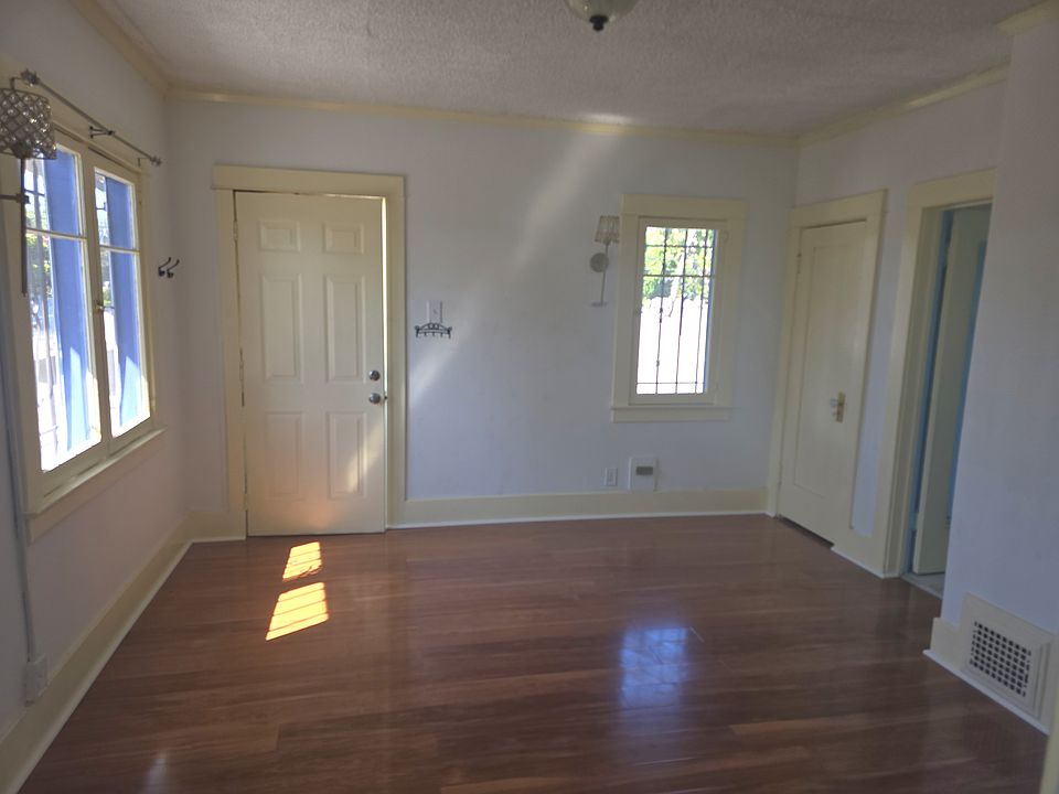 Living Room Area with closet, bathroom and hallway to bedroom to the right