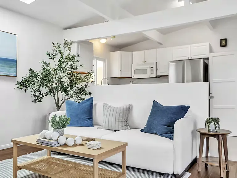 Cozy living room with a relaxing 3-seater couch. It also converts into a comfortable extra bed for additional guests!