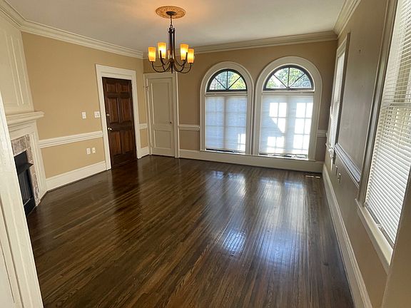 georgous large living room with gas fireplace and large Palladian windows which allow for lots of light to fill the room