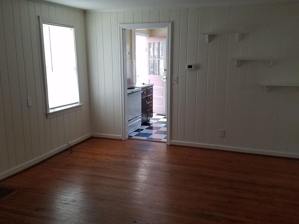 This is the living room looking towards the kitchen and front door.