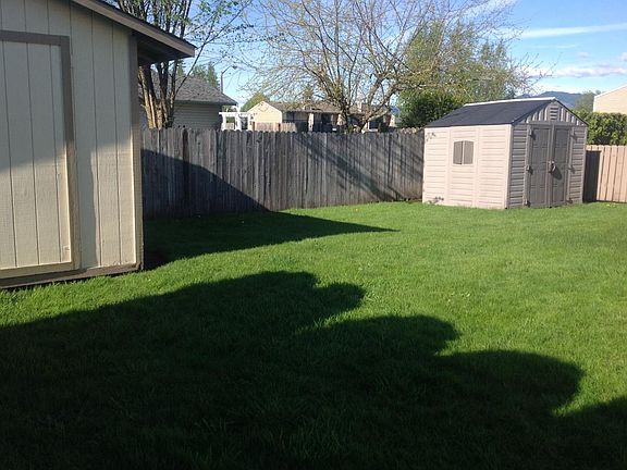 2 storage sheds in private back yard.