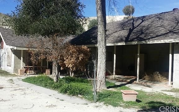 Main house totally habitable with 1 bedroom, 1 bath, full kitchen, bath and additional room under construction.  Power, phone and water on the property.