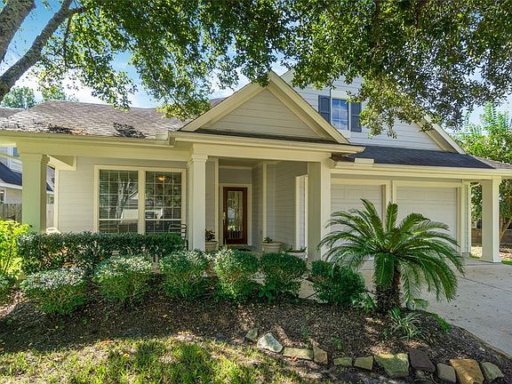 Beautiful craftsman style home with lovely entry through a porch at the front of the home.