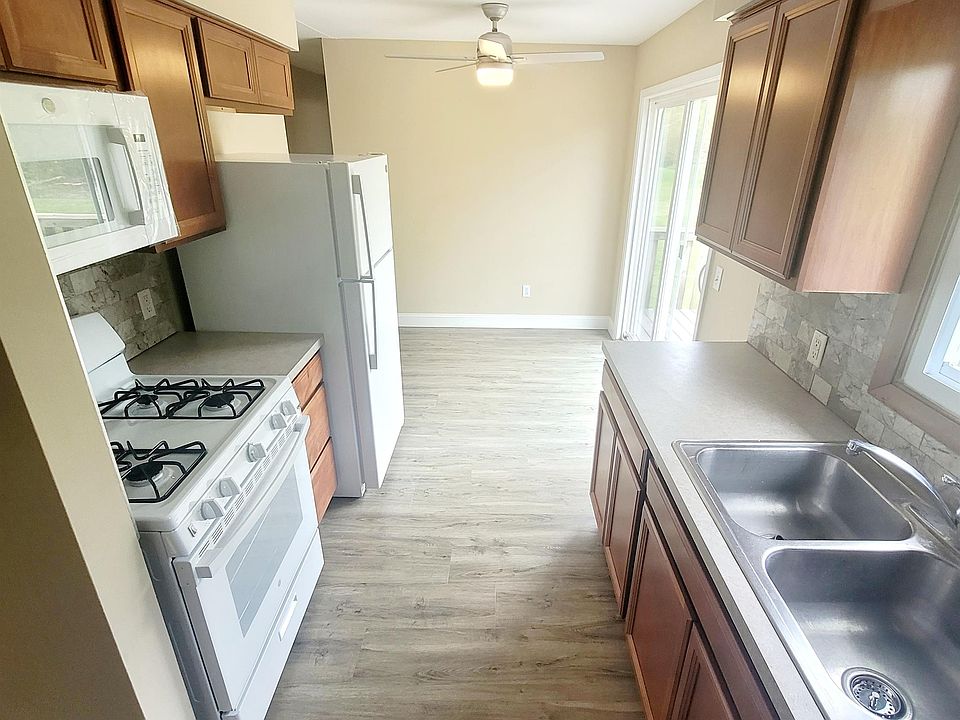 Kitchen and dining area with slider access to rear patio