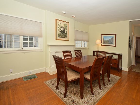 Dining w/ hardwood flooring