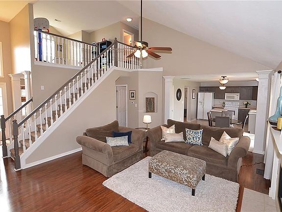 Large open floor plan perfect for entertaining. Newly painted railing 2018. New interior paint 2018. New laminate flooring 2012. New ceiling fan 2008