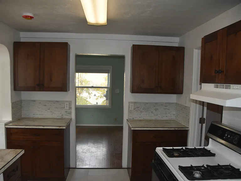 Kitchen looking to Living Room, Dinette area to left of picture between counters.