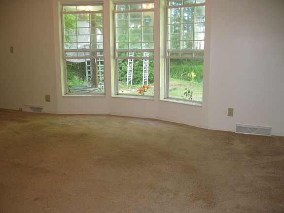 bay window in living room, vaulted ceilings