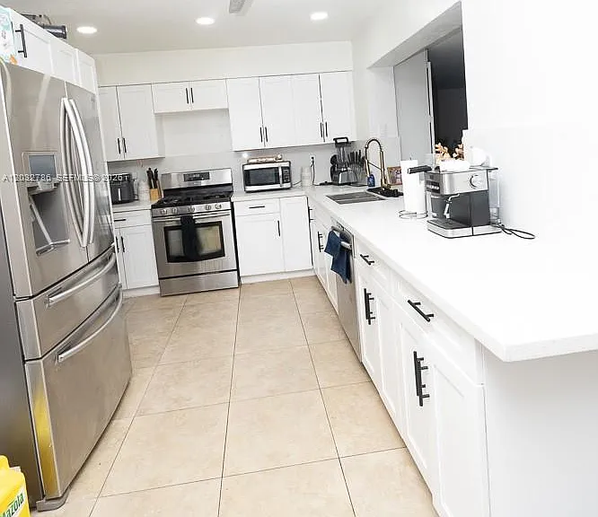 5941 NW 14th Ct — Photo 9