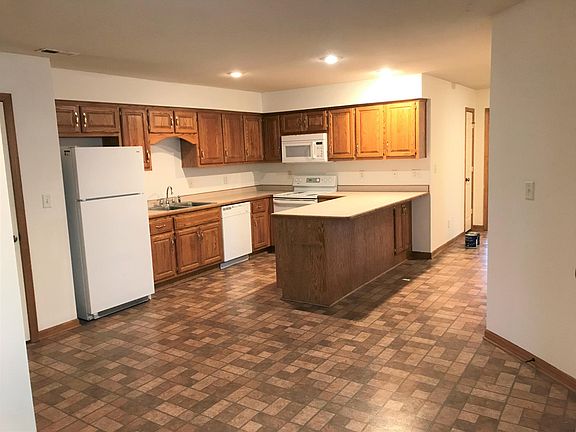 KITCHEN FROM LR ... TONS OF CABINETS AND PANTRY TO LEFT OF REFRIGERATOR