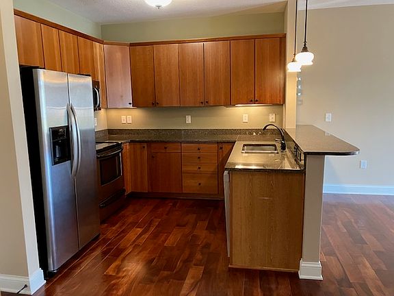 Well appointed kitchen with plenty of counter top space and cupboards. Stove, microwave, dishwasher and side by side fridge.