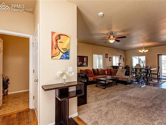 THE FAMILY ROOM AND EATING AREA ARE VISIBLE FROM THE FRONT DOOR