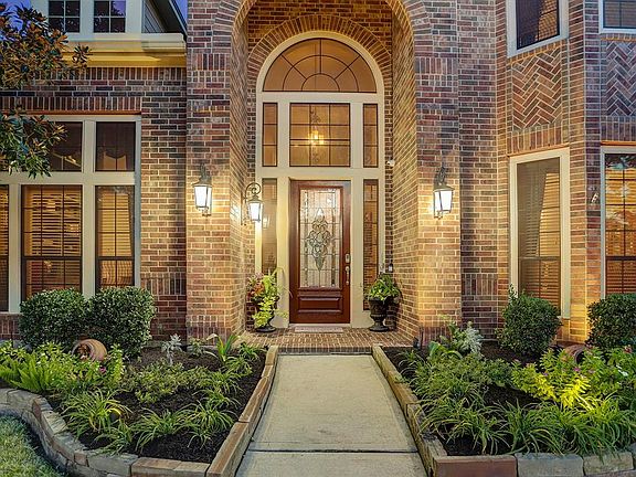 Your guests will be welcomed by an impressive covered brick entry with handsome coach lights and a elegant leaded glass door with surrounding transom windows. Let's take a closer look...we promise, you will not be disappointed.
