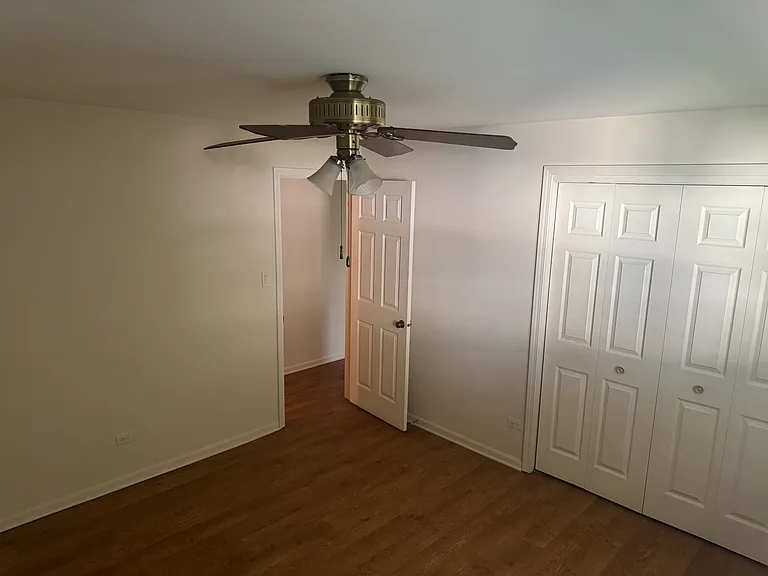 Bedroom One toward the front of the house with large closet.