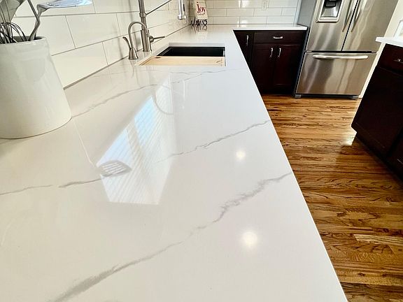 New Quartz counter top and subway backsplash.