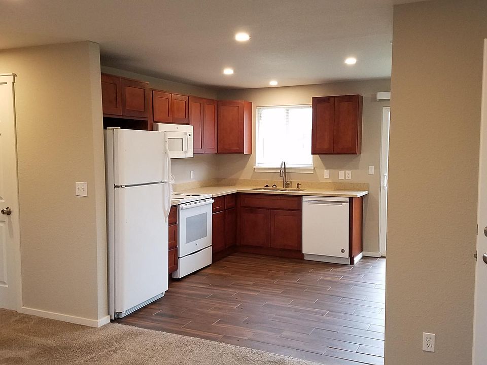 Fully remodeled kitchen with modern undercover sink, granite countertops, tile floors and recessed lighting!