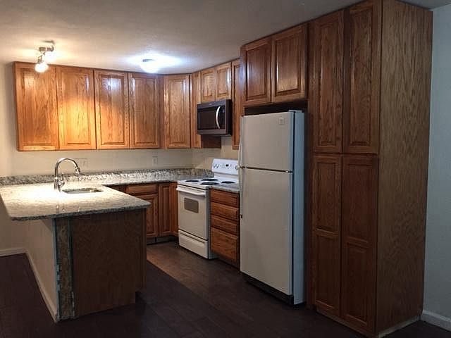 New granite countertop, new cabinets, new microwave, new dis
