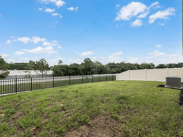 Private fenced-in backyard with room to relax or play.