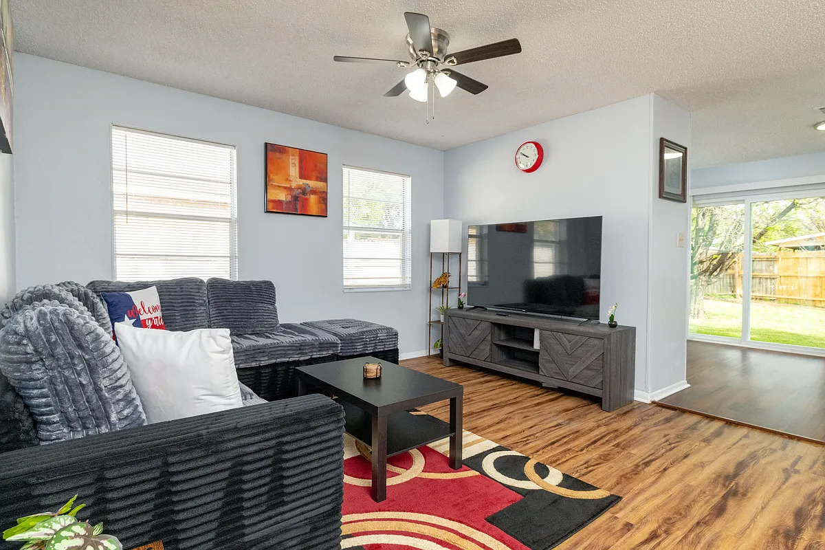 Relax in style with plush seating, a big screen, and plenty of natural light. - 2445 Dancy Dr N