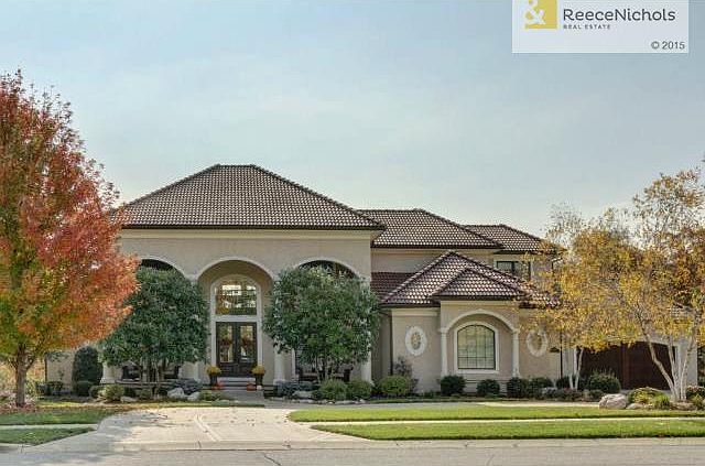 Distinctive 1.5 story, 5 bedroom home on 1 acre lot with large c