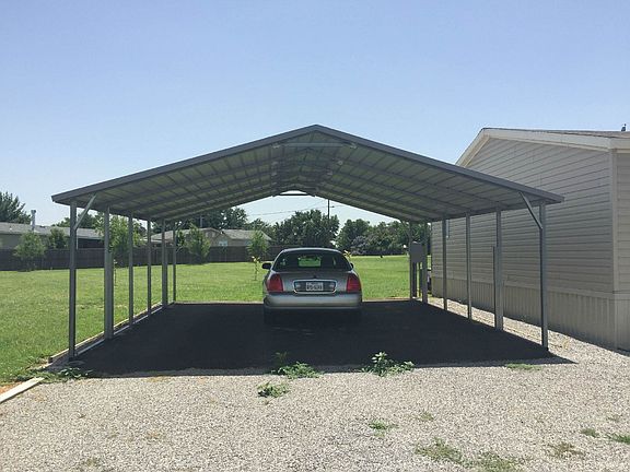 DOUBLE CARPORT WITH ASPHALT