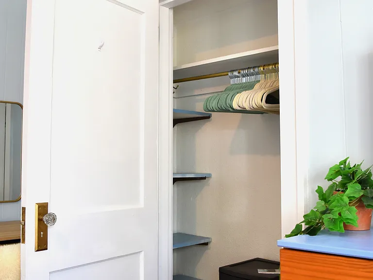 Closet is small but has shelving, drawers, and plenty of hangers