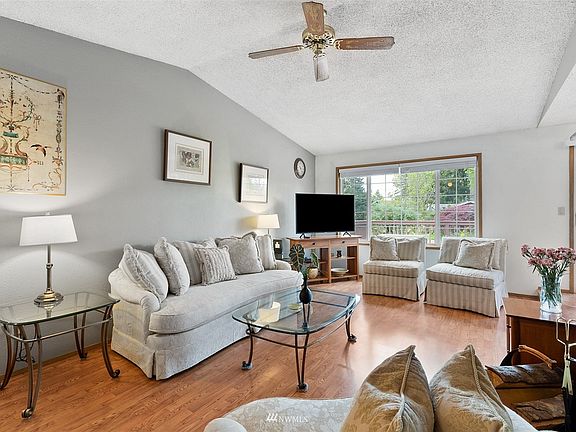 Vaulted ceilings in the luminous living adds to its sense of space. 