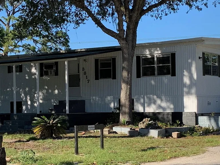 Doublewide, 2 bedroom, 2 full bath, front porch and back patio, laundry room, tile floors. Country setting in small mobile home property. Room for small boat parking. Designated parking / 2 spaces