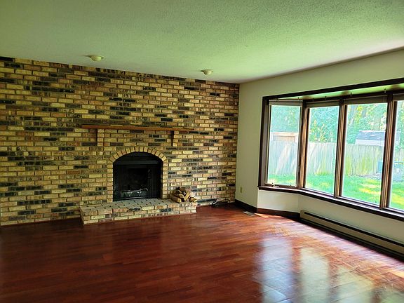 Family room with fireplace and bay window
